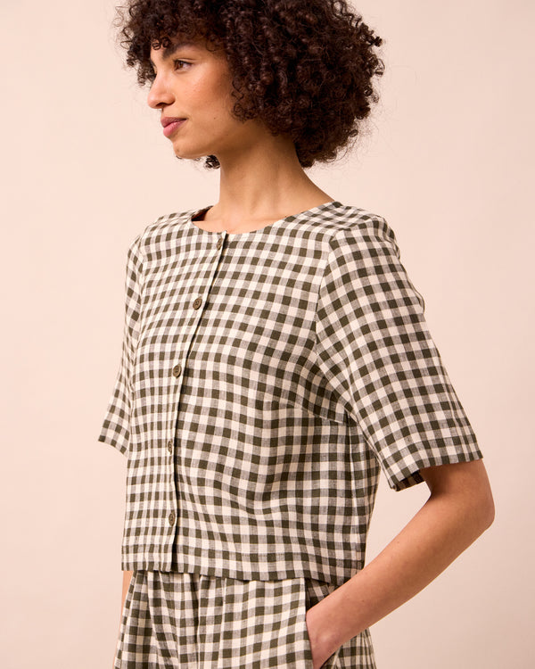 model wears evelyn olive gingham linen top