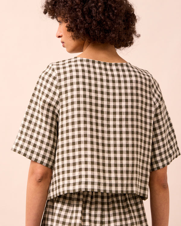 model wears evelyn olive gingham linen top