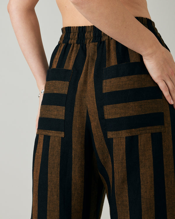 model wears rust stripe lexi linen trousers