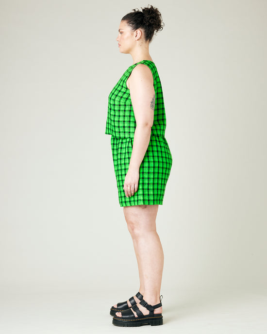 model wears green and black check ari shorts