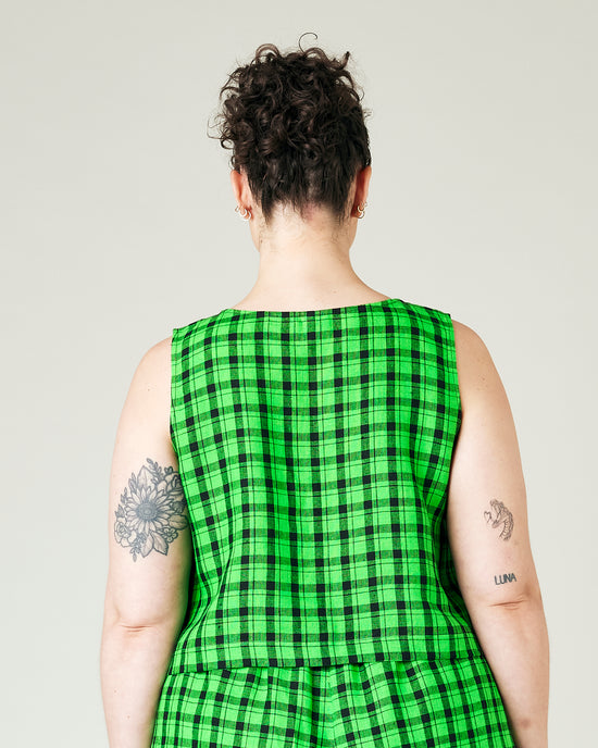 model wears green check linen esme top