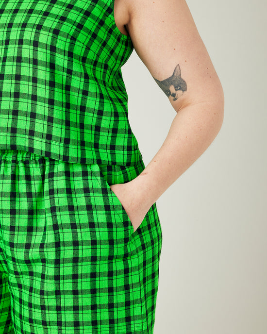 model wears green check linen esme top