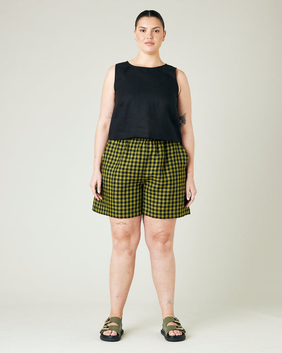 model wears green gingham ari shorts