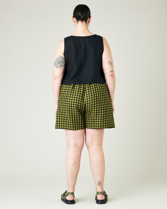 model wears green gingham ari shorts