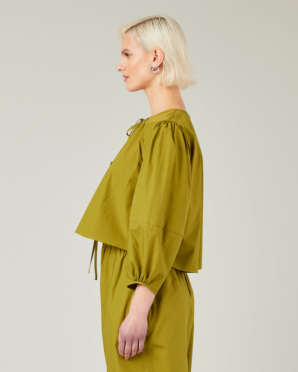 model wears olive poplin fleur top 