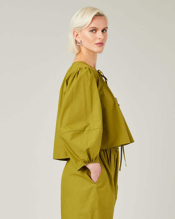 model wears olive poplin fleur top 