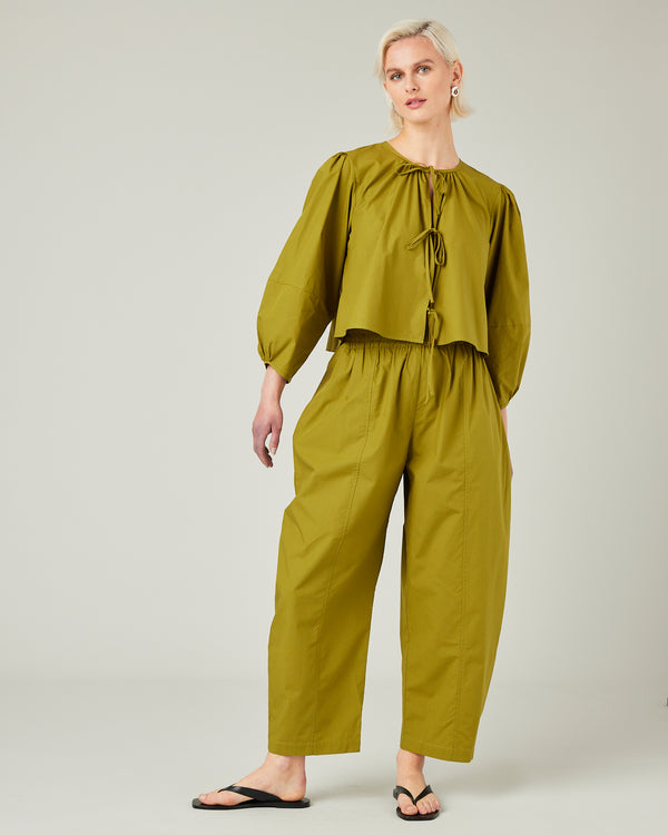 model wears olive poplin fleur top 