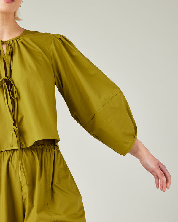 model wears olive poplin fleur top 