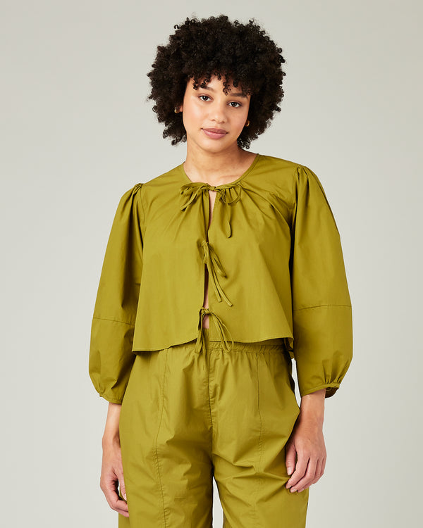 pregnant model wears olive poplin fleur top 