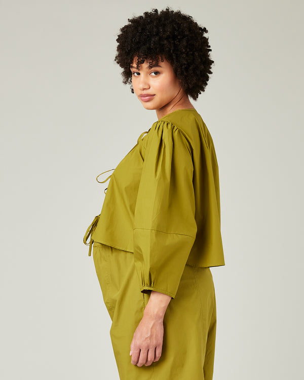 pregnant model wears olive poplin fleur top 