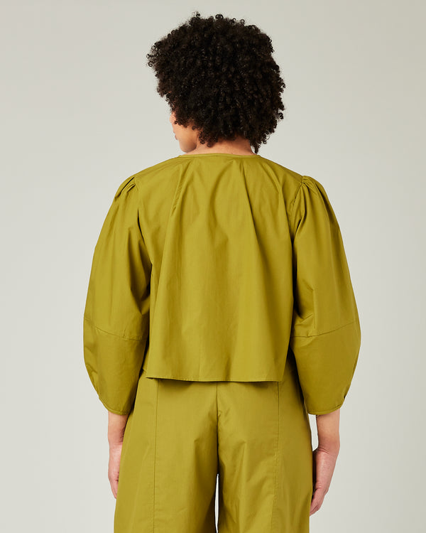 pregnant model wears olive poplin fleur top 