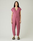 pregnant model wears autumn rose jersey frankie jumpsuit