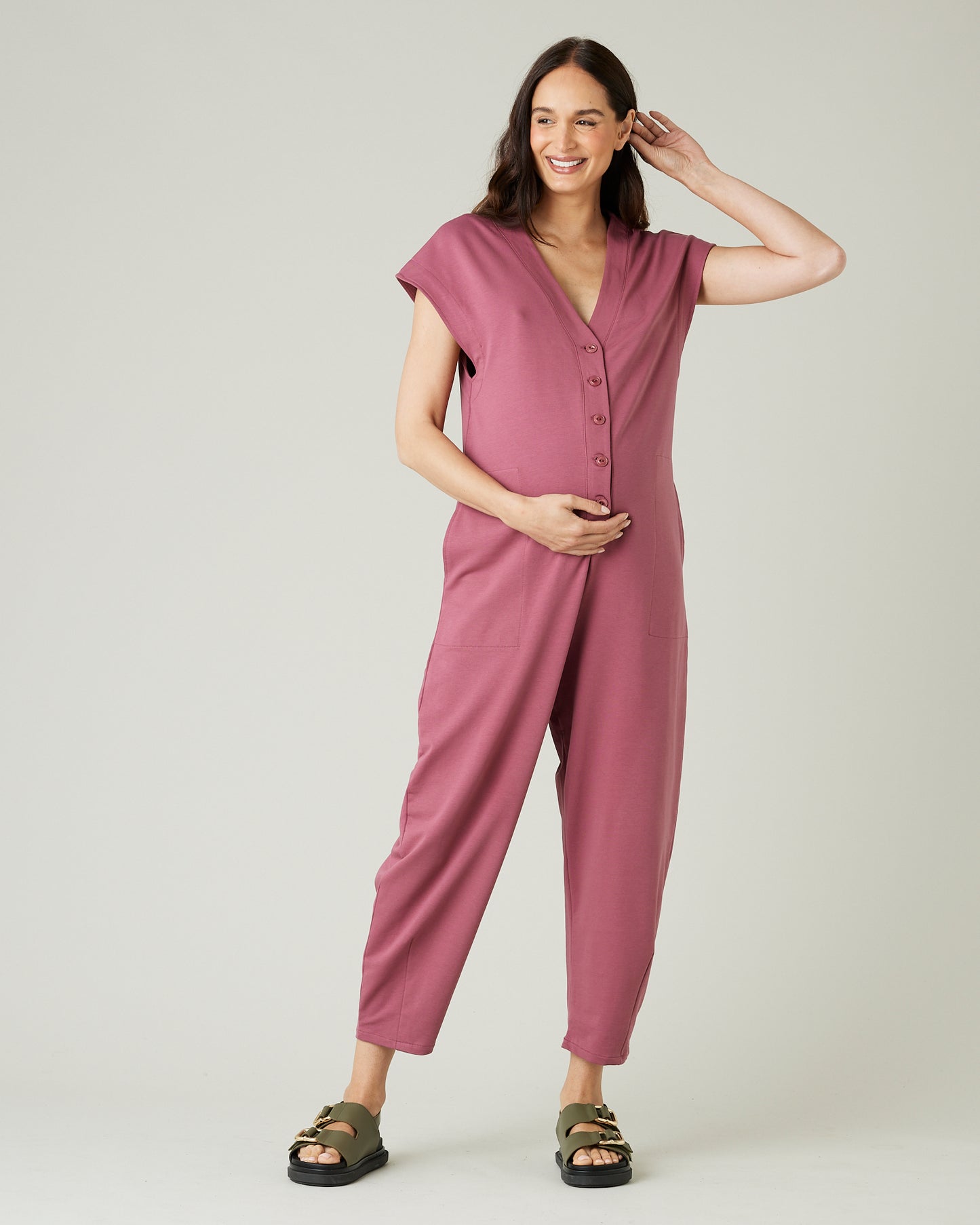 pregnant model wears autumn rose jersey frankie jumpsuit