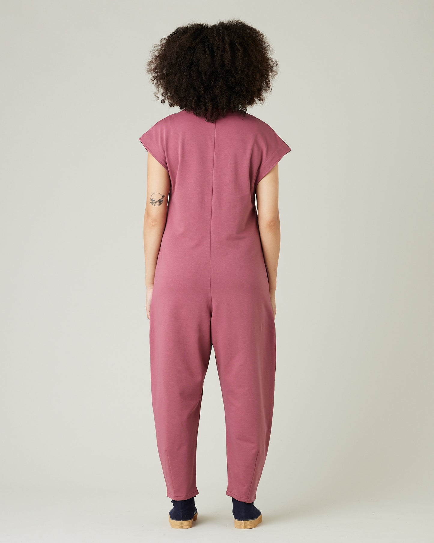 model wears autumn rose jersey frankie jumpsuit