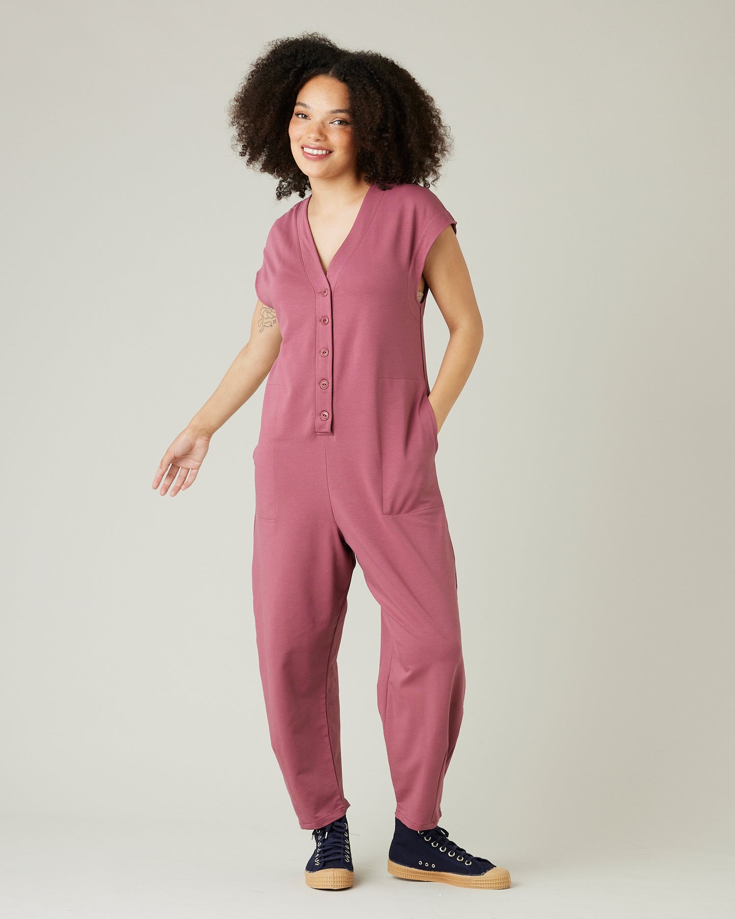 model wears autumn rose jersey frankie jumpsuit