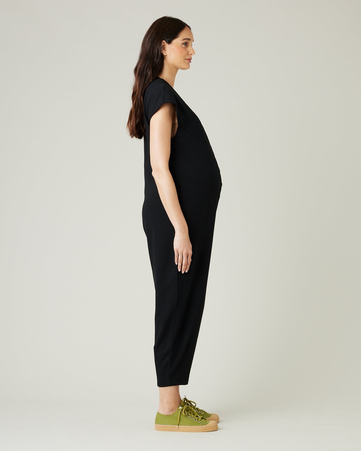 pregnant model wears black jersey frankie jumpsuit