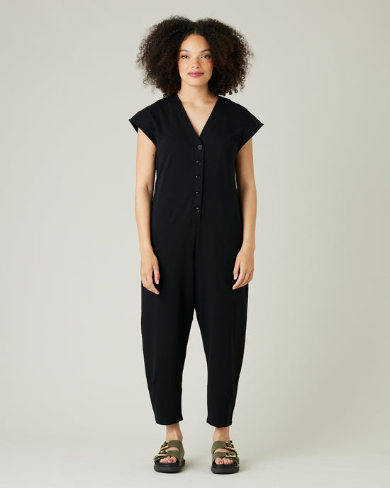 model wears black jersey frankie jumpsuit