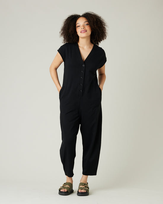 model wears black jersey frankie jumpsuit