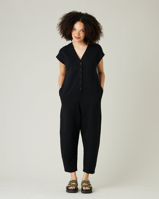 model wears black jersey frankie jumpsuit