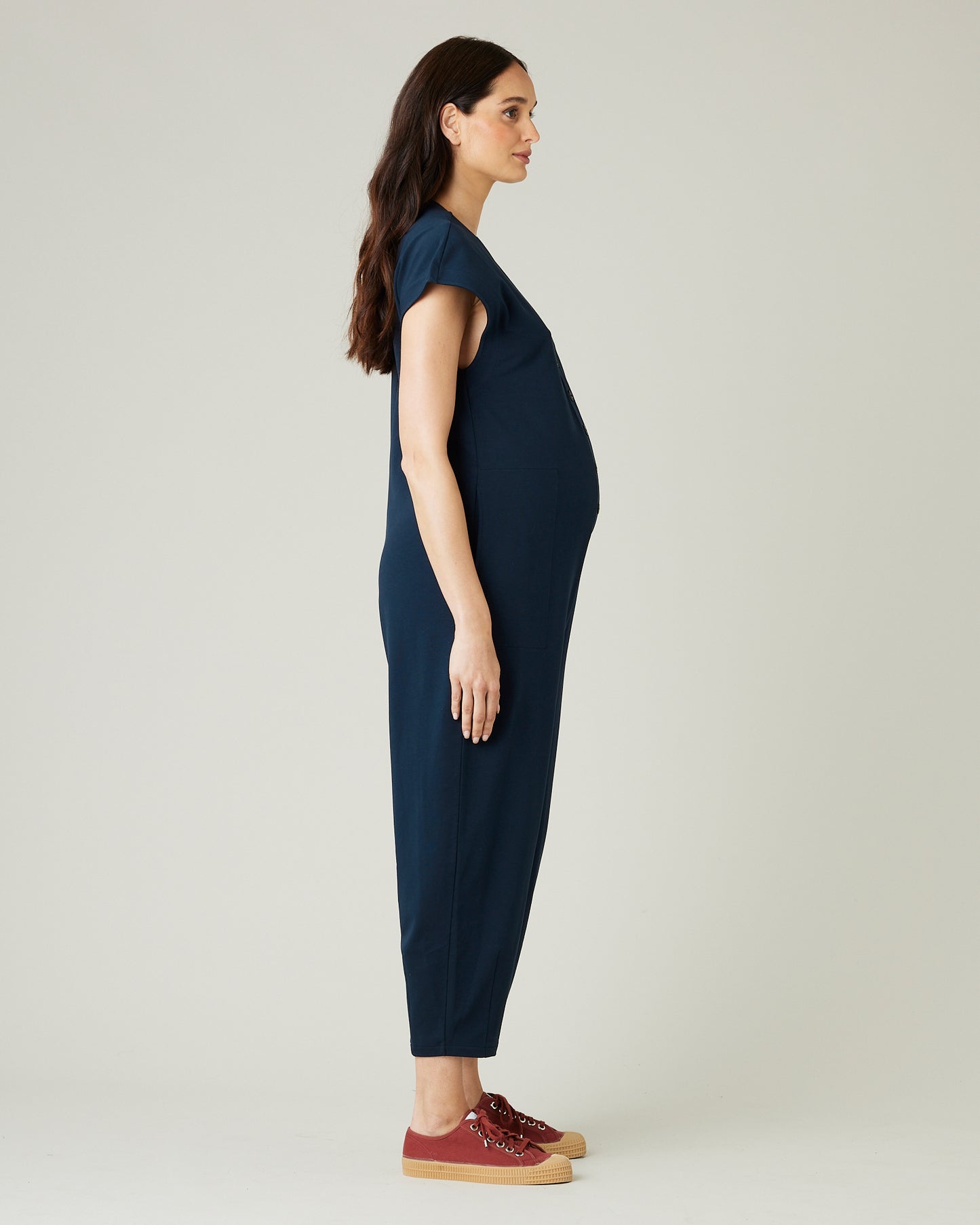 pregnant model wears navy jersey frankie jumpsuit