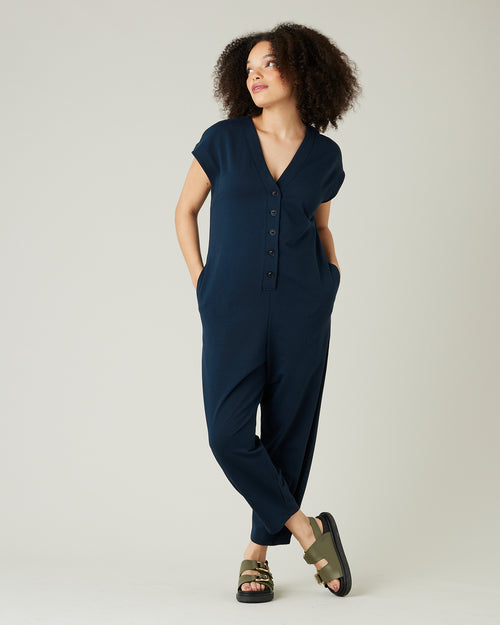 model wears navy jersey frankie jumpsuit