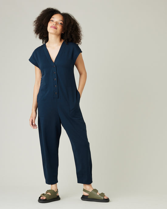 model wears navy jersey frankie jumpsuit