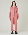 model wears rose denim coverall