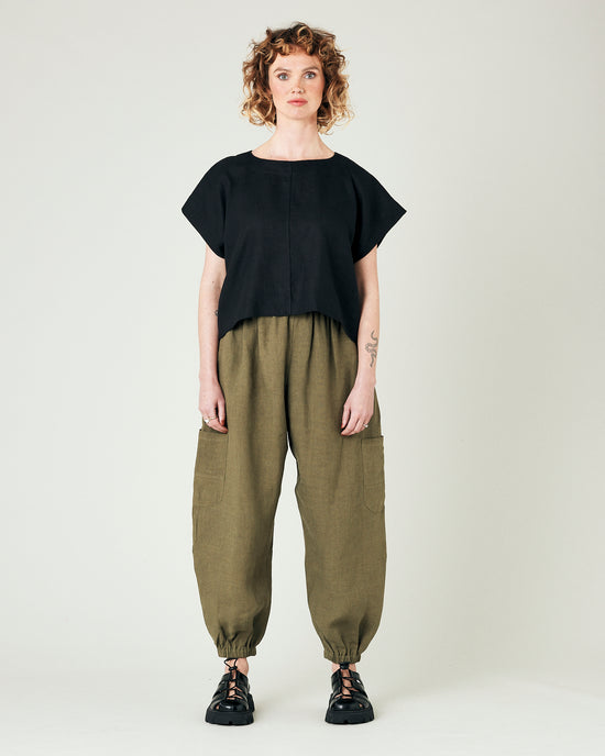 model wears light khaki linen yoli trousers