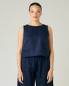 model wears navy linen esme top