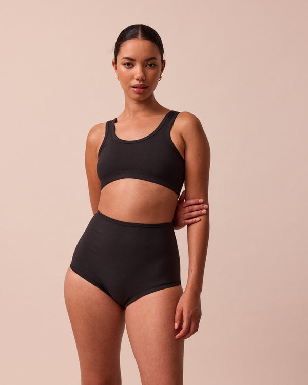 model wears black full coverage jersey knicker