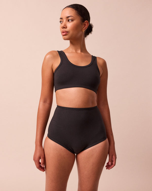 model wears black jersey bralette