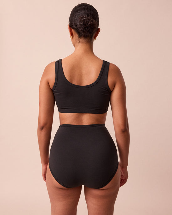 model wears black full coverage jersey knicker