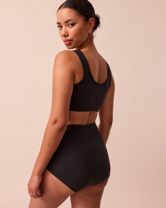 model wears black full coverage jersey knicker