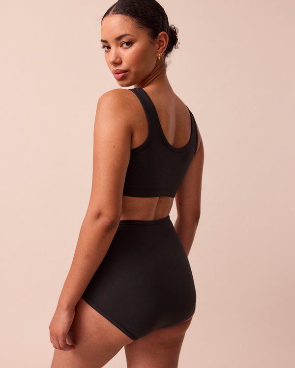 model wears black full coverage jersey knicker