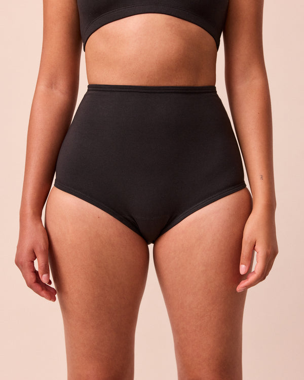 model wears black full coverage jersey knicker