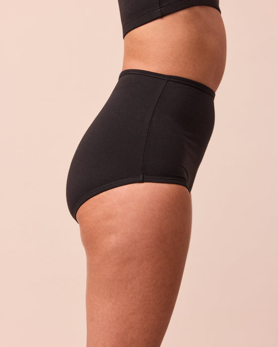 model wears black full coverage jersey knicker