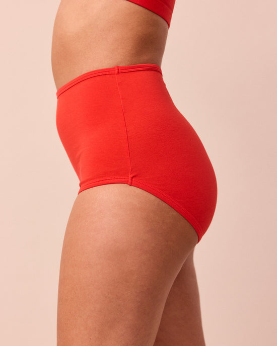 model wears tomato red full coverage jersey knicker