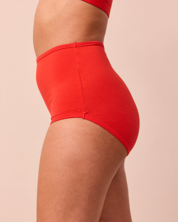 model wears tomato red full coverage jersey knicker