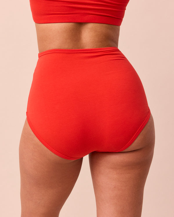 model wears tomato red full coverage jersey knicker