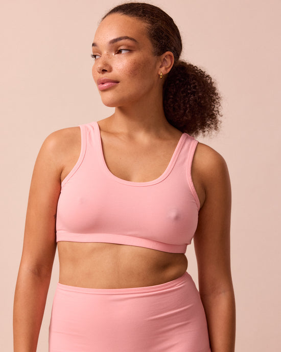 model wears petal pink jersey bralette