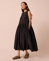 model wears gina black cotton poplin dress