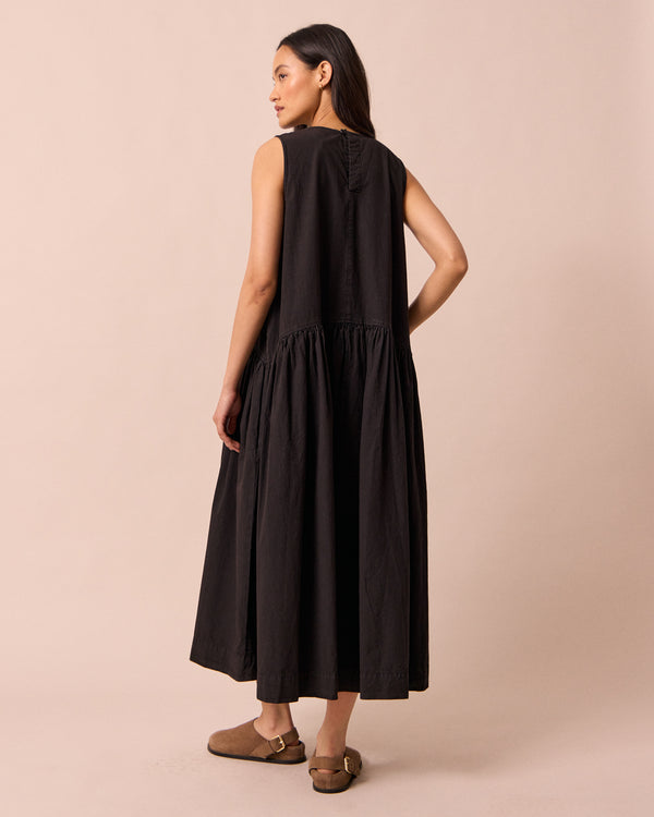 model wears gina black cotton poplin dress