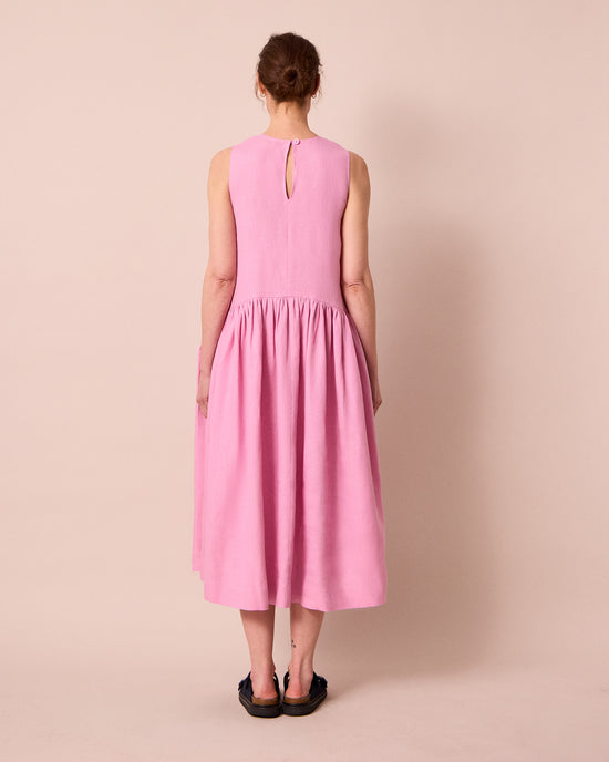 model wears gina rose pink linen dress
