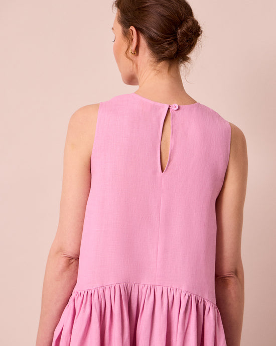 model wears gina rose pink linen dress
