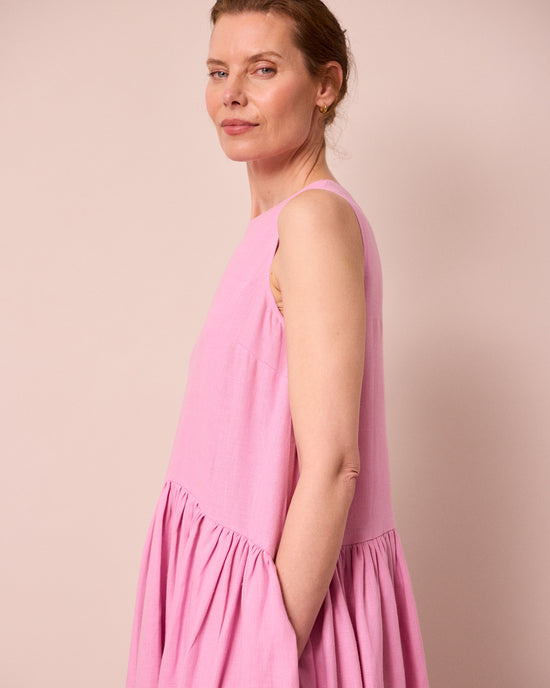 model wears gina rose pink linen dress