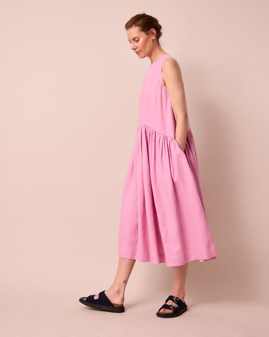 model wears gina rose pink linen dress