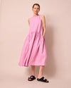 model wears gina rose pink linen dress