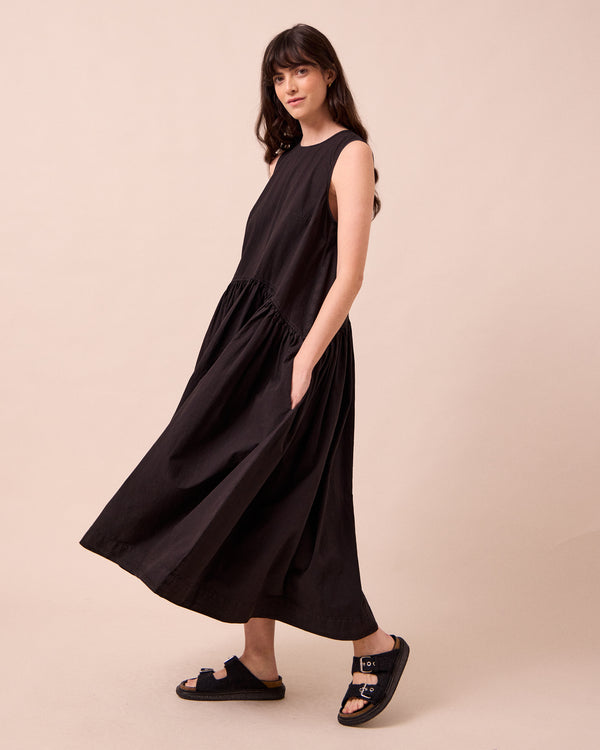 model wears gina washed black cotton poplin dress