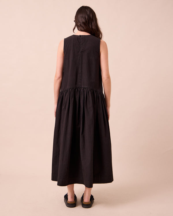 model wears gina washed black cotton poplin dress
