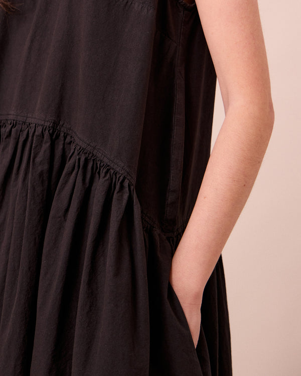 model wears gina washed black cotton poplin dress